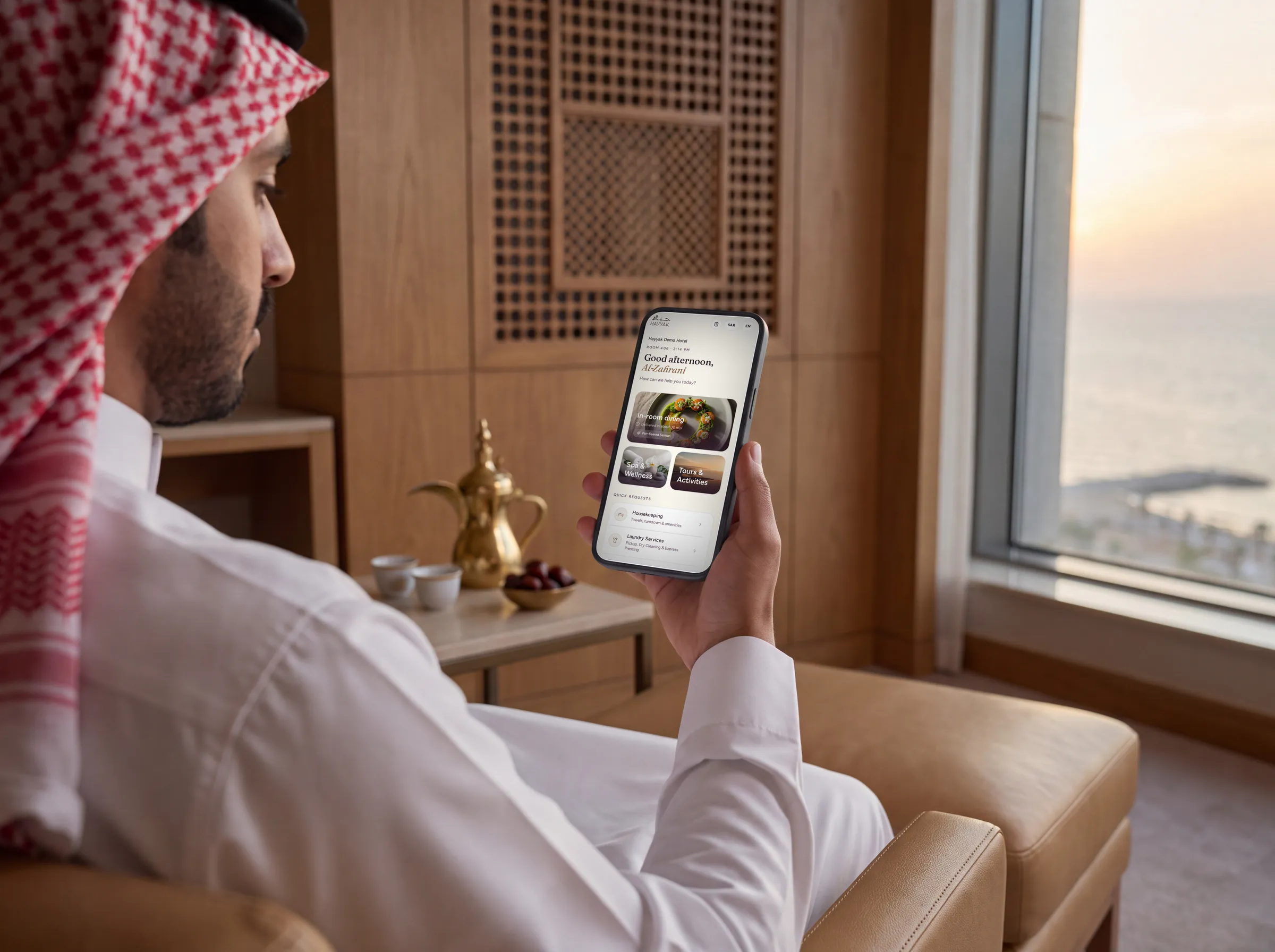 A hotel guest in Saudi Arabia ordering from the phone in his room